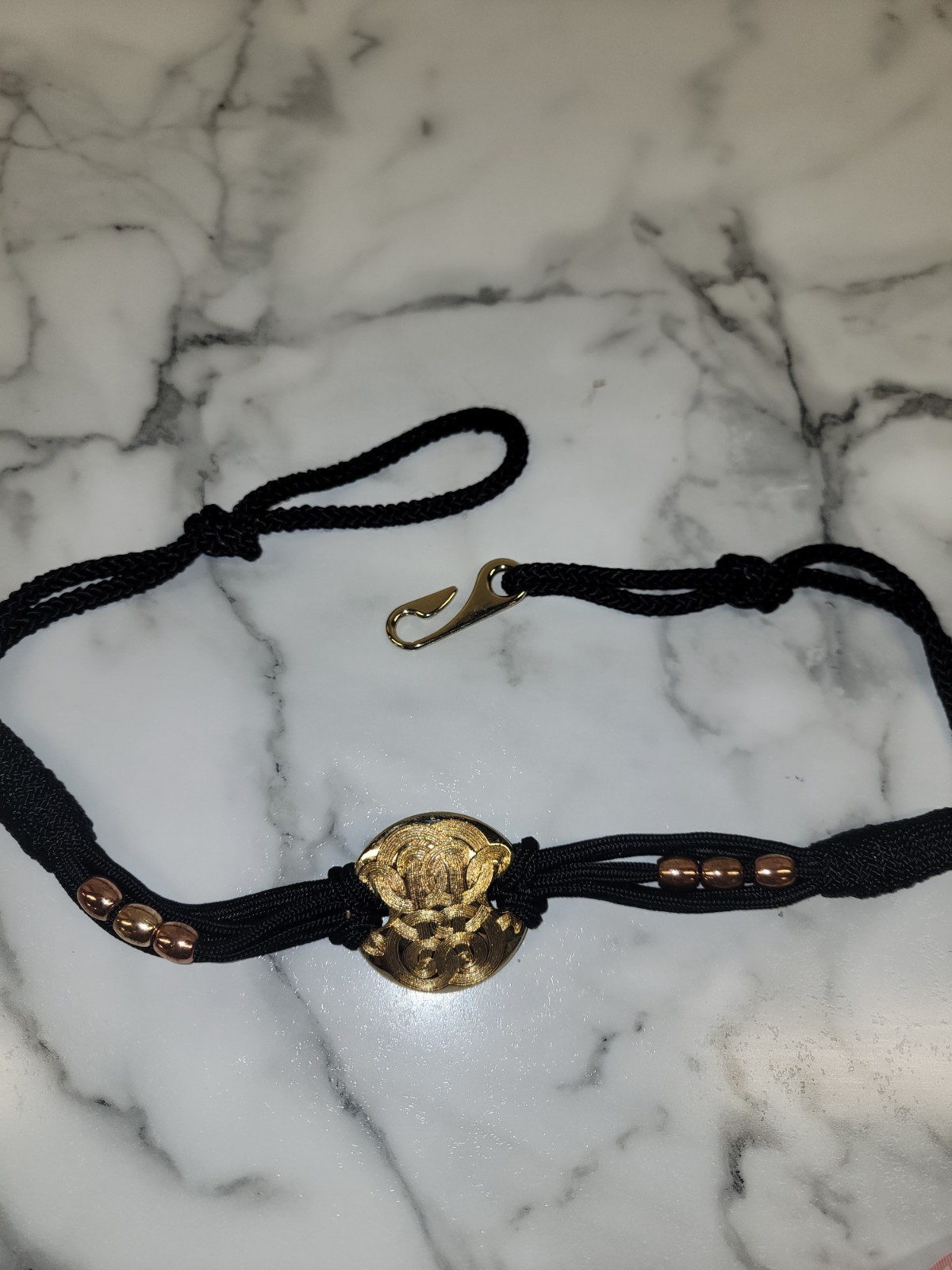 Vintage 1980's gold disc and black cord belt