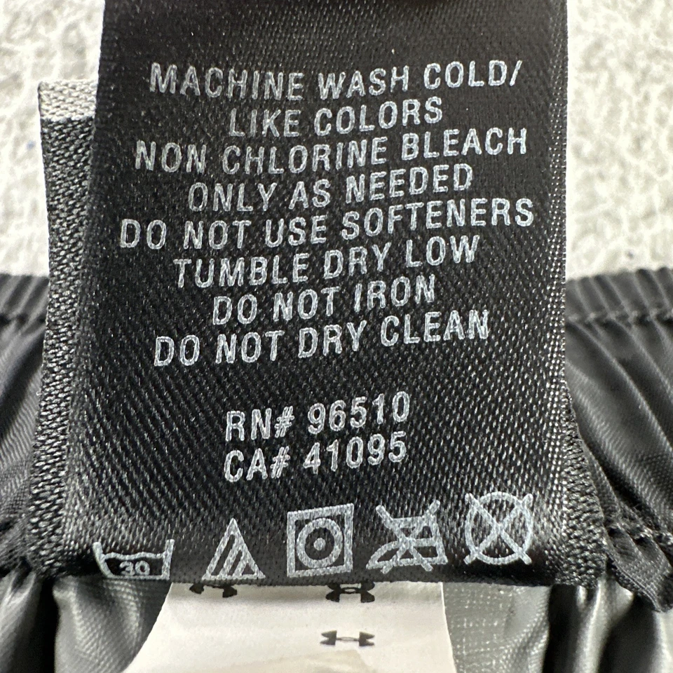 Pantalones deportivos Under Armour de nailon cortavientos para hombre grandes negros con cremallera al tobillo ligeros Foto 3 de 4