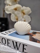 Beach-inspired shell-shaped candle