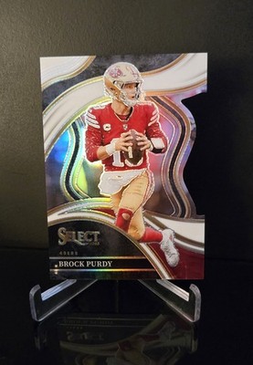 #'d/199   BROCK PURDY SP 2023 Panini Select Club Level White Prizm Die-Cut #293