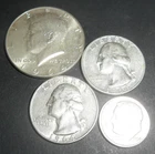 Four 90% Silver Coins.  One Kennedy Half Dollar, 2 Quarters and 1 Dime.