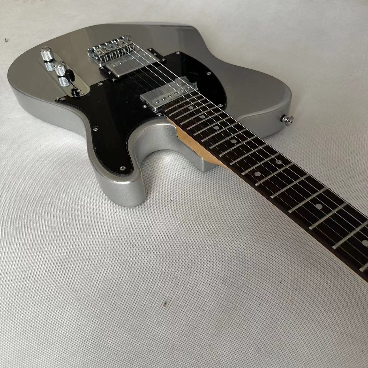 Silver powder white TL electric guitar, fixed bridge black protective plate, alternate view 4