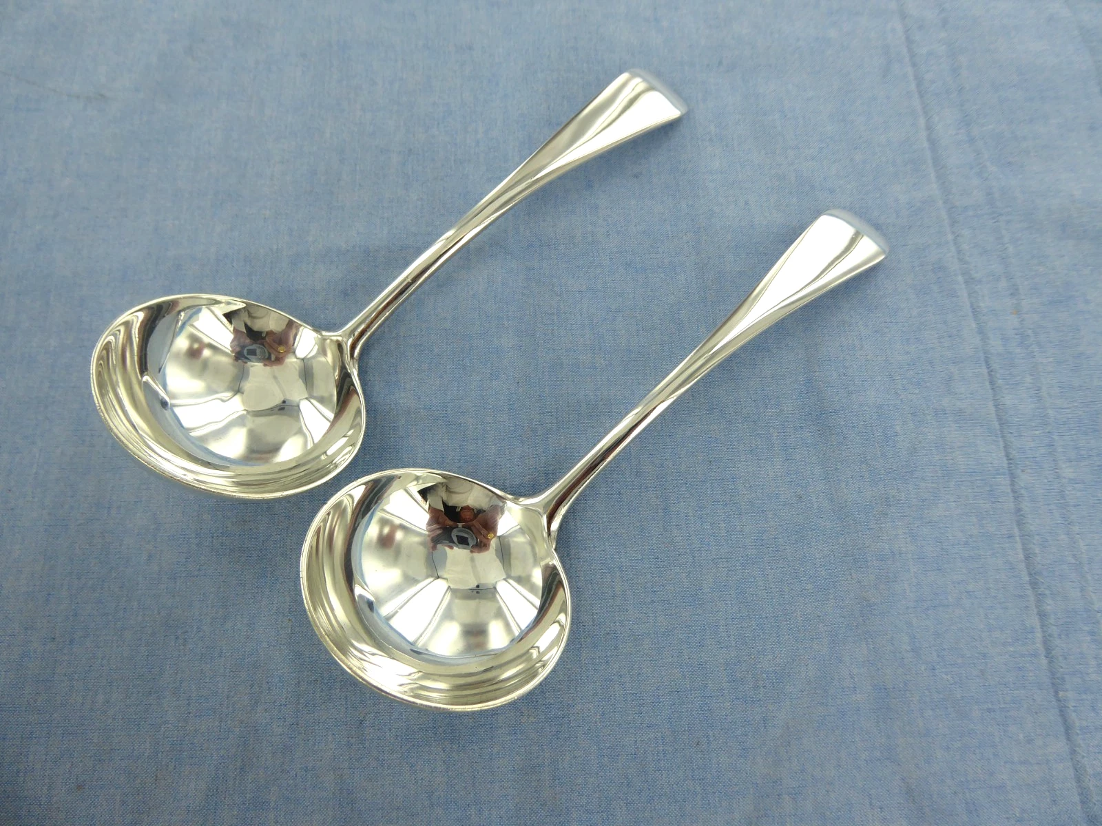A VINTAGE PAIR OF STERLING SILVER, OLD ENGLISH SAUCE LADLES, LONDON 1931.
Opens in a new window or t