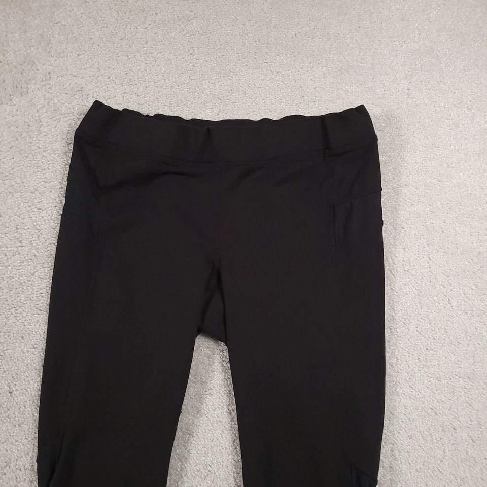 Leggings cortos Athleta para mujer medianos negros de malla bolsillo capri elásticos gimnasio activo Foto 3 de 4