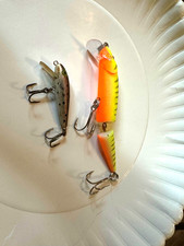 two lures one appears jointed minnow and small ? trout bait both good
