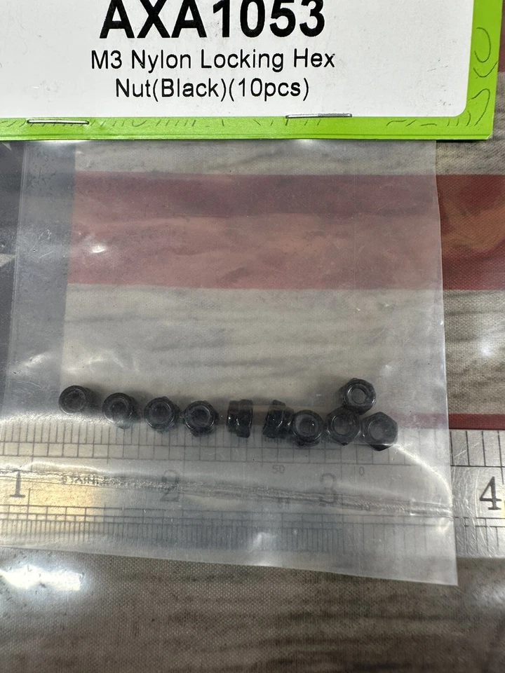 Tuerca hexagonal de bloqueo de nailon AXIAL AXA1053 M3 negra 10 piezas. Foto 3 de 4