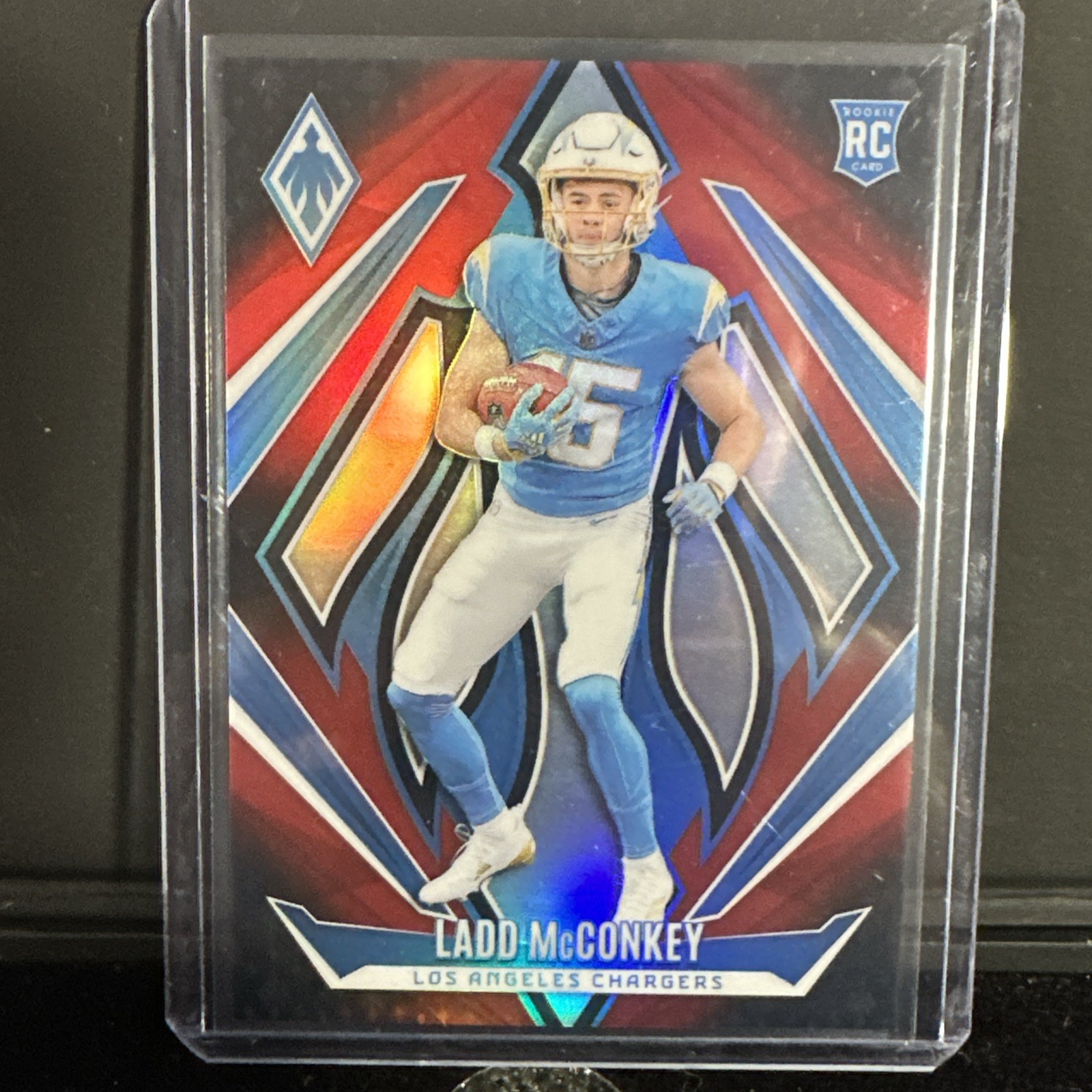 2024 Panini Phoenix #216 Ladd McConkey Red Fade Prizm Rookie #’d /299 RC Charger