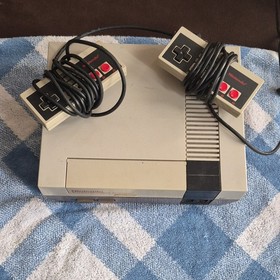 Nintendo NES Console with Controllers, NES Advantage Joystick, Zapper, and Games