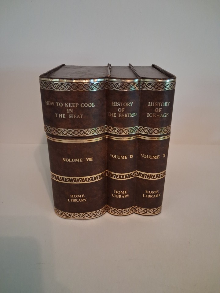 A Norleans 'Encyclopedia' ice bucket disguised as a book set — the ultimate hidden-barware conversation piece for the shelf-proud host.
