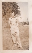 WW2 Photo of Soldier Standing Outdoors Near Palm Trees