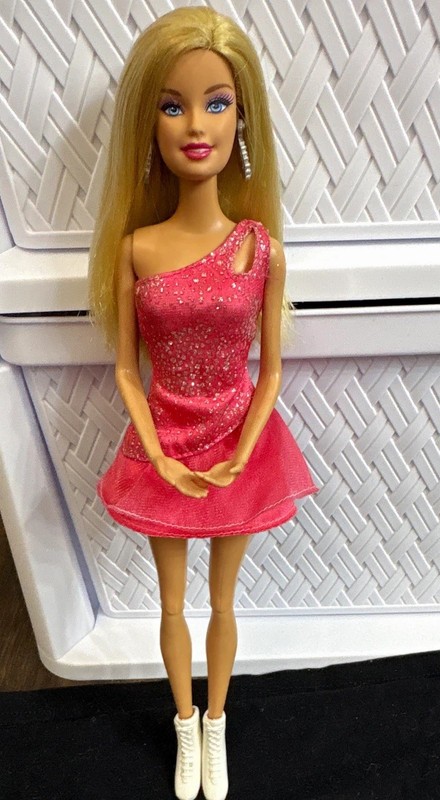 Mattel Barbie With Ice skating Outfit & Bathing Suit 2009