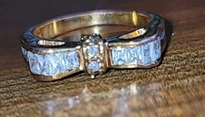 Gold Tone Bow Design Ring Size 7 With Baguette And Round Channel Set Stones