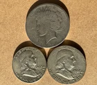 3) US Silver Coins, 1) Peace dollar, 2) Franklin half dollars. 1.49 Troy Ounces