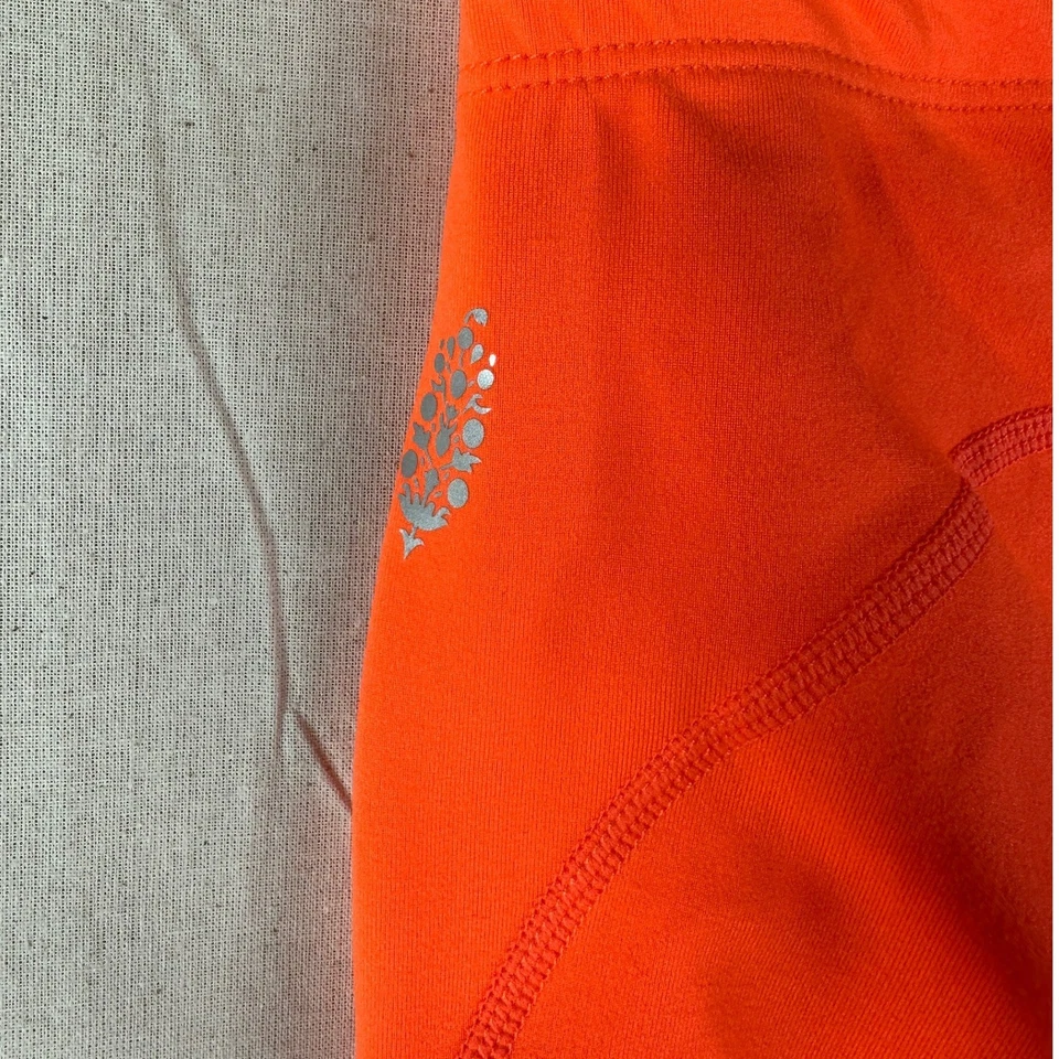 Pantalones cintura elástica Free People Movement talla pequeña naranja Foto 3 de 4