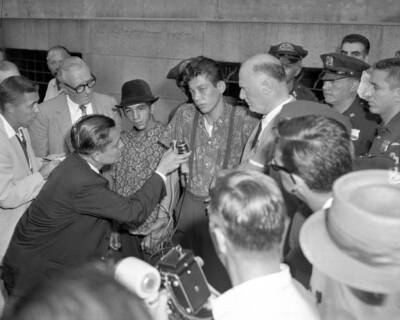 Reporters crowd around Umbrella Man Tony Hernandez and Cape Man Sa .. Old Photo