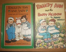 2 Books - Raggedy Ann and Andy  Camel with the Wrinkled Knees & the Happy Meadow