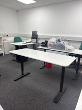 White Desk With Wiring Sorting Net Underneath And Adjustable Height