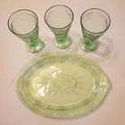 Vibrant Uranium Depression Glass, Oval Platter and three Footed Glasses.
