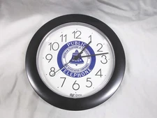 Wall clock with Public Telephone/Bell System logo on face-- black color