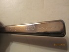 Vintage silver Playtex Hair Cutter with black handle, engraved “100% Safe-Stainfree” beside engraved “7/11/2018.”