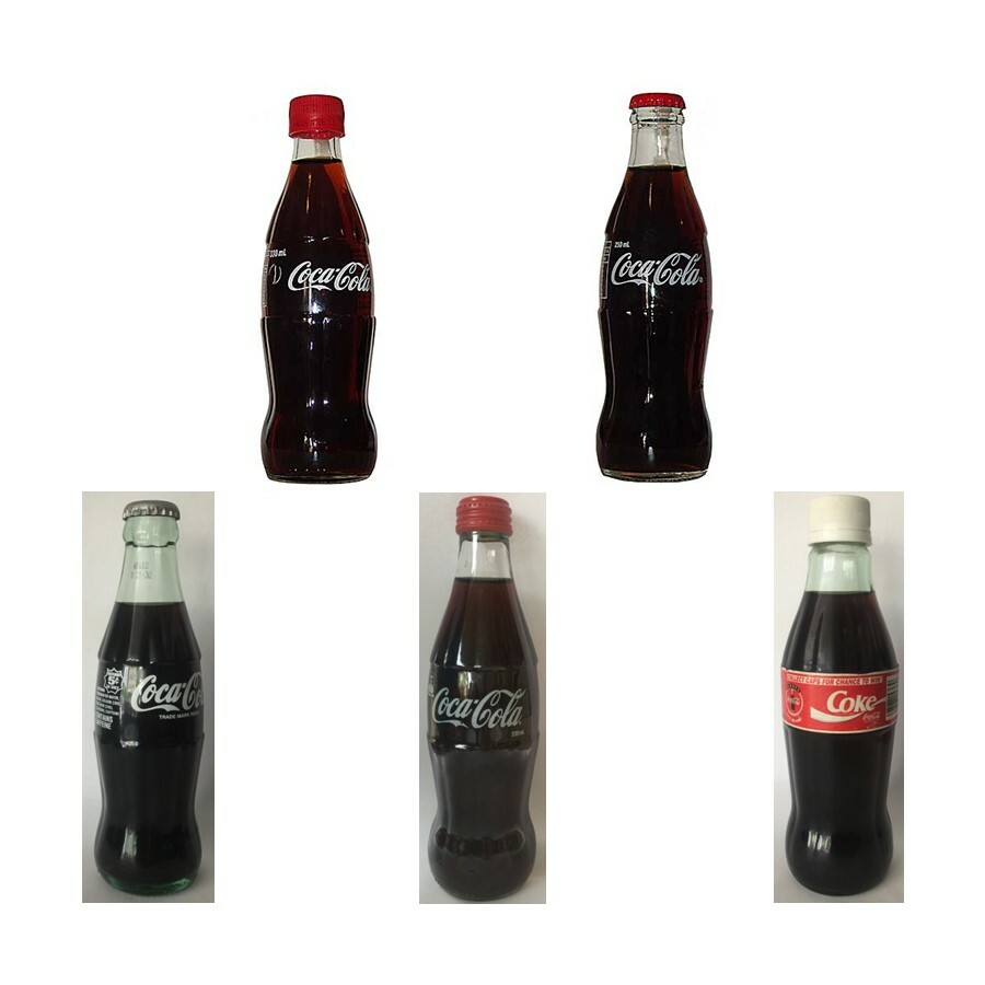 Australian Coca Cola bottles, full and unopened, various caps and