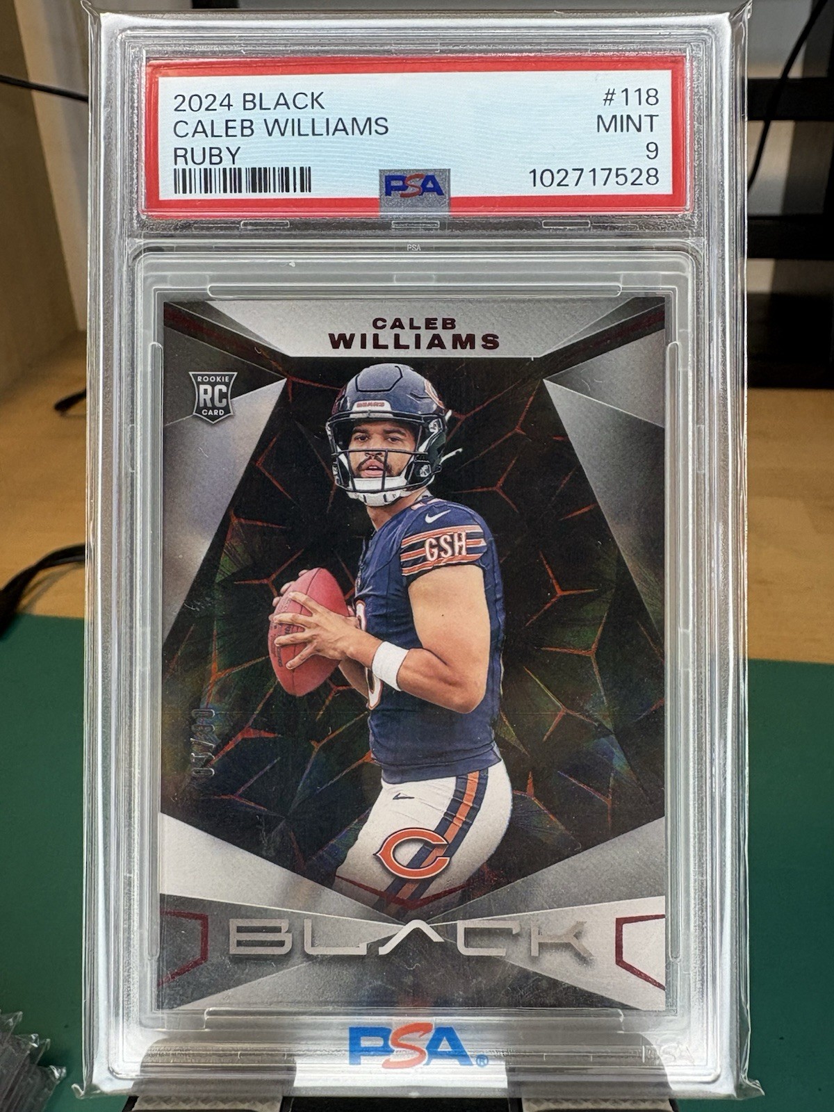 2024 Panini Black - Rookies Caleb Williams #118 Ruby /10 (RC)