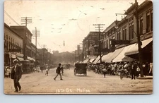 RPPC Real Photo Postcard Illinois Moline 15th St Fisk & Loosely Sign Posted 1910