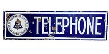 A LARGE VINTAGE ENAMELED ADVERTISEMENT TELEPHONE SIGN CIRCA 1950