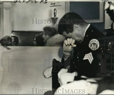 1975 Press Photo Sgt. Henry Spako sits beside casket of slain Detective Tardiff