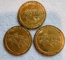 Three Brass $1 gaming token from The New Frontier Casino, Las Vegas.