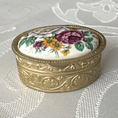 Bursa Medikamentendose oval Metall Blumenmotiv gold/mehrfarbig Reisegröße IT