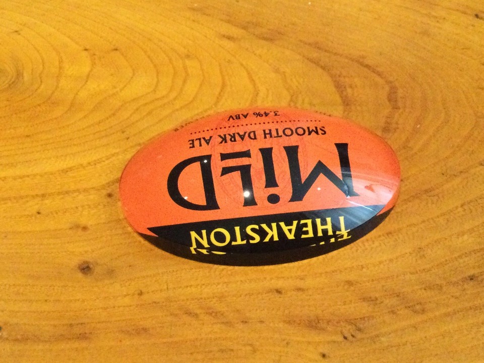 Theakston Mild Smooth Dark Ale OVAL Fisheye badge, Beer Font Pump Bar