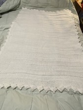 Precious white crocheted baby blanket