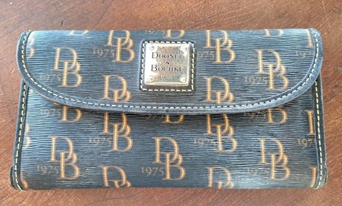 Dooney & Bourke Wallet 1975 All Over Pattern, 7"W X 4"T....Good Condition