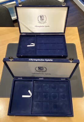 2 Große Velours Münzkassetten  Olympische Spiele  mit je 12 Fächern 55x55mm