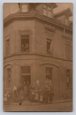 RPPC brick building street scene kids maggi Postcard Portrait Real Photo dog