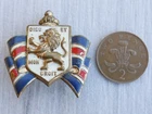 A USA WW2 BWRS British War Relief Society fundraising lion and shield pin badge