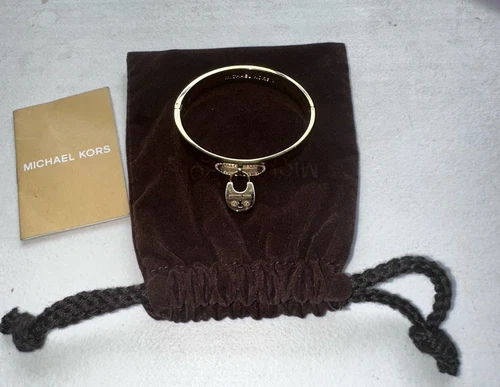 Bracciale Michael Kors con lucchetto cristallo ferramenta paesaggio urbano tono oro