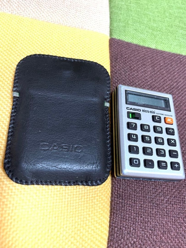 A Showa-era CASIO Micro Mini calculator so tiny and perfectly retro it's basically wearable tech from another dimension — a genuinely rare Japanese collector's piece.