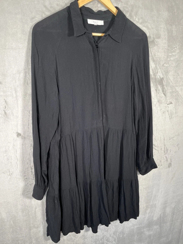 Mini vestido minimalista babydoll columpio negro grande de manga larga para mujer Foto 2 de 4