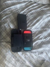 Nintendo Switch 32GB Black Console with Neon Red and Neon Blue Joy-Con. HAC-001