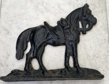 VICTORIAN 1880 - 1900 CAST IRON DOOR STOP FEATURING A SADDLED UP HORSE