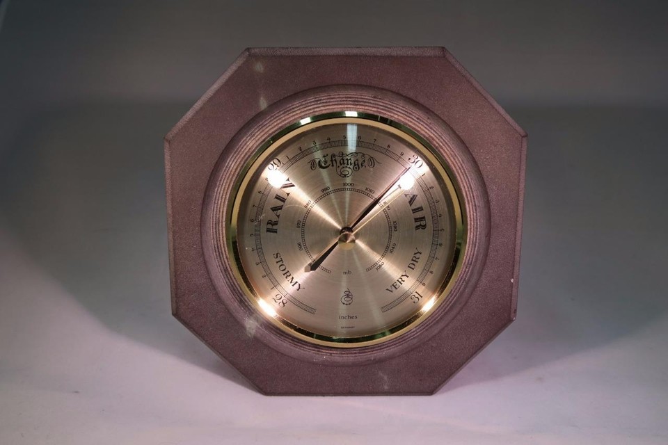 UNUSUAL ANEROID BAROMETER IN GREY STONE CASING.