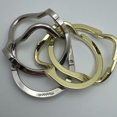 Hanayama Hustle Cast Metal Rings Brainteaser Puzzle Silver Gold Tone Game 