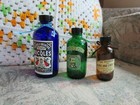 Small Blue, Green, and Brown Decorative Bottles w/ Stickers and Ribbons — photo 1