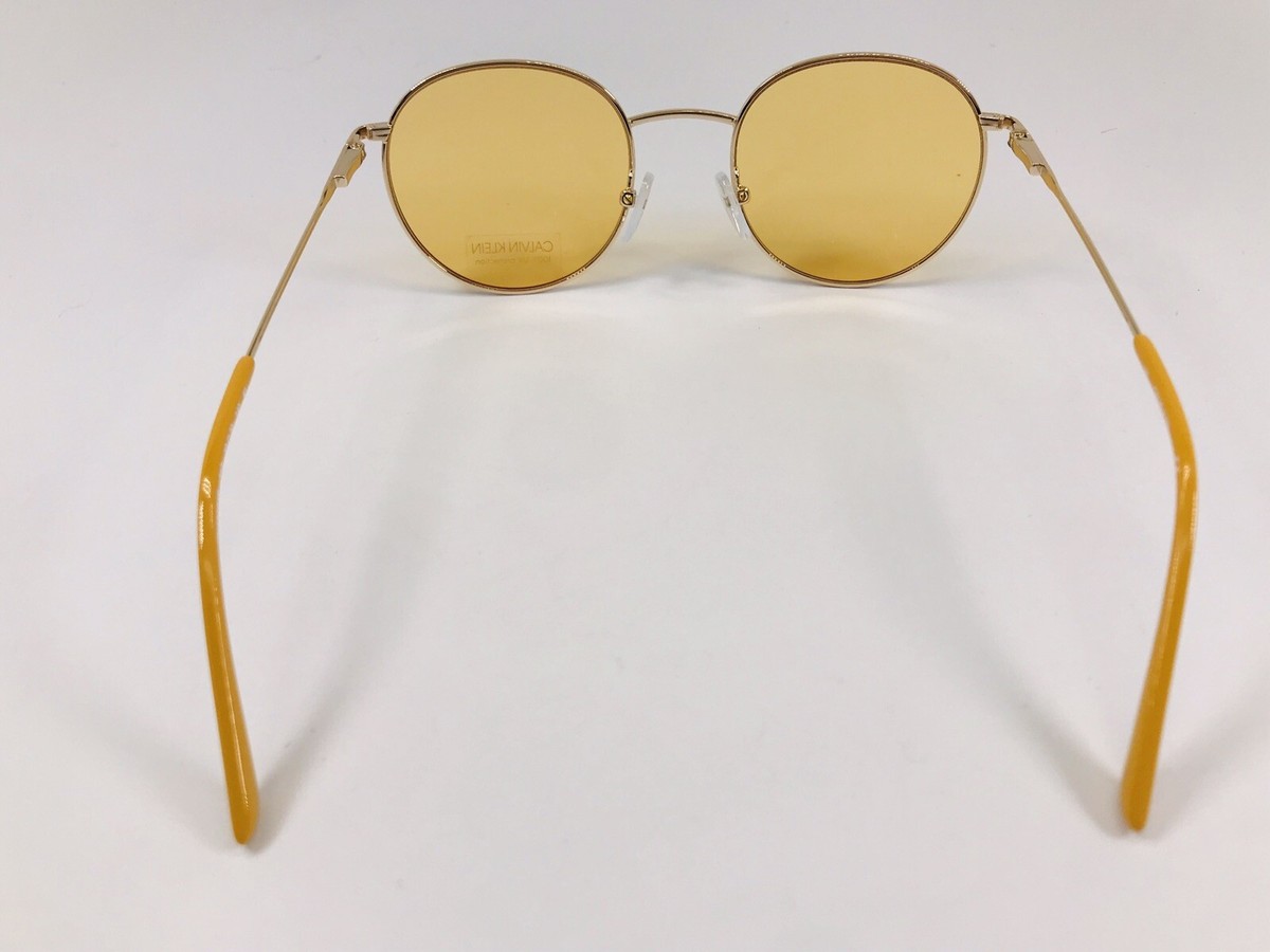 New Calvin Klein CK18104S 717 Round Gold & Maize Sunglasses