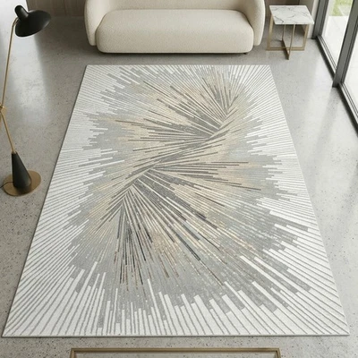 Un tapis avec un motif abstrait et des fibres brillantes argentées et bro - Photo 1/4