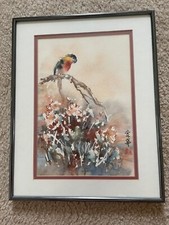 Asian Watercolor Painting of Scarlet Macaw Perched on a Tree Overlooking Flowers
