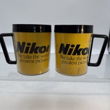 2 Vintage Nikon Mug Thermal Plastic Weighted Base Black Yellow Logo USA⬇️