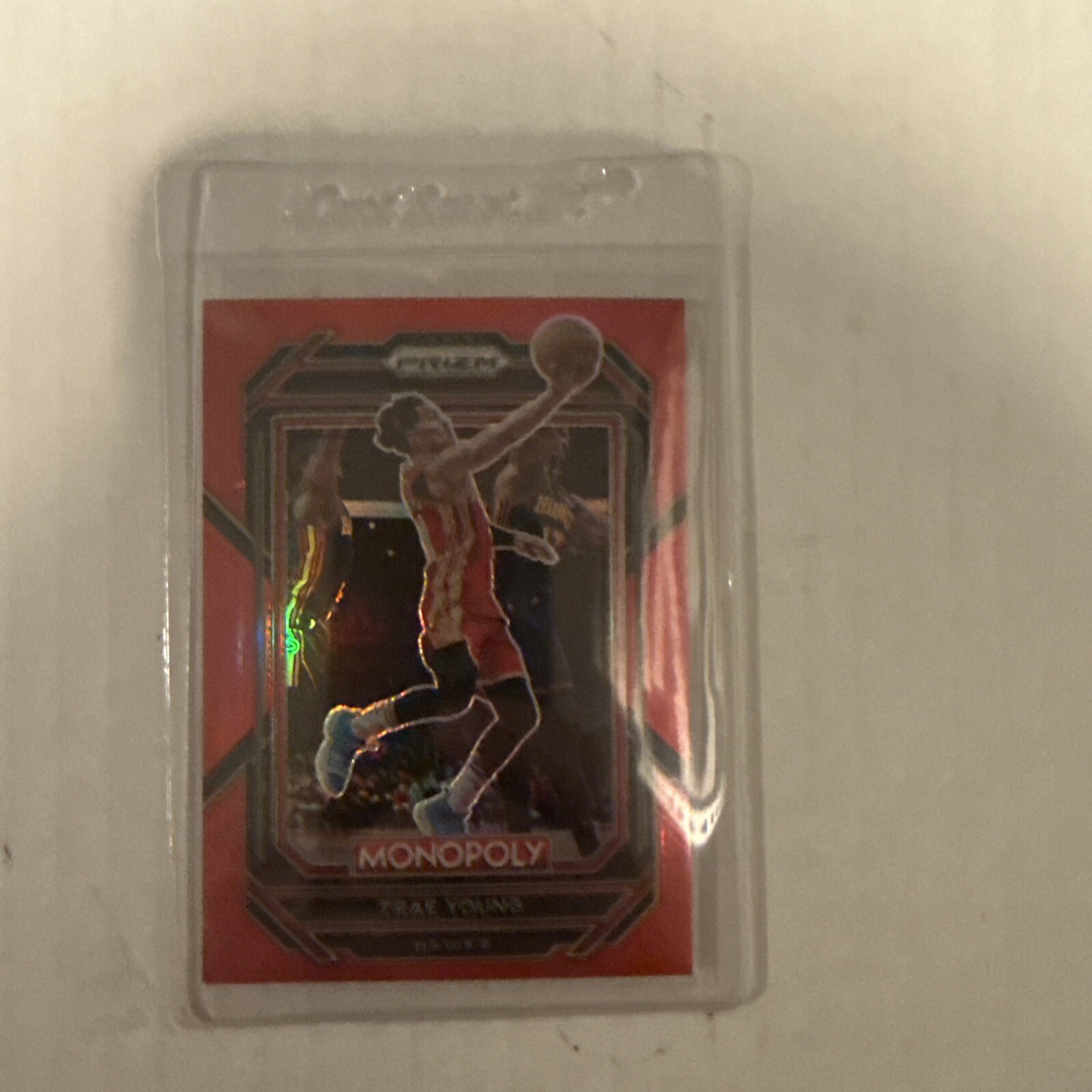 K112,594 - 2022-23 Panini Prizm Monopoly Red #1 Trae Young #/99